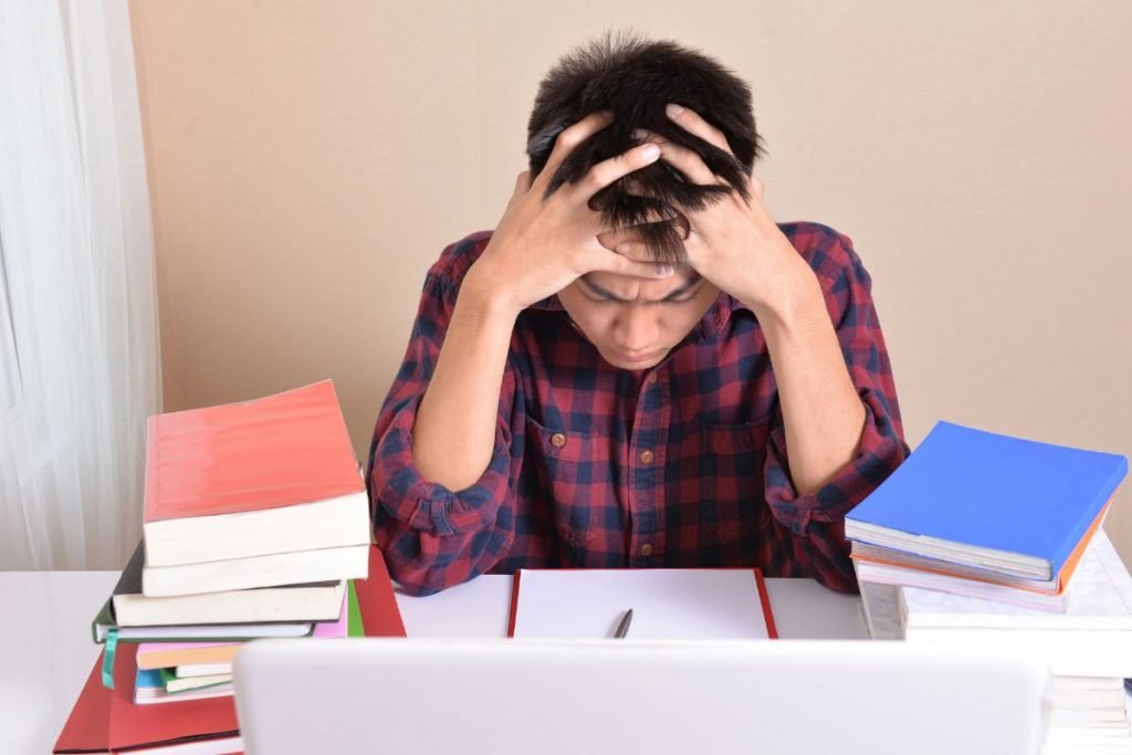 stressed boy while studying