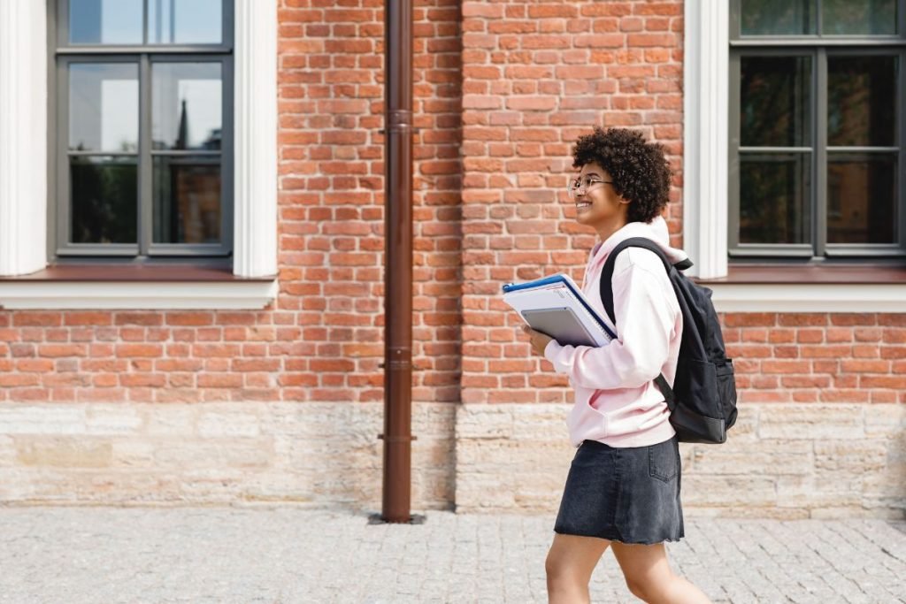 student walking to her home