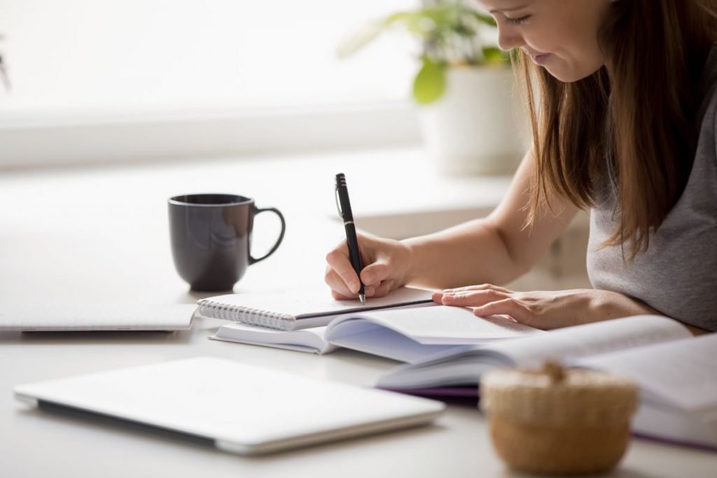 girl preparing at home for her essay