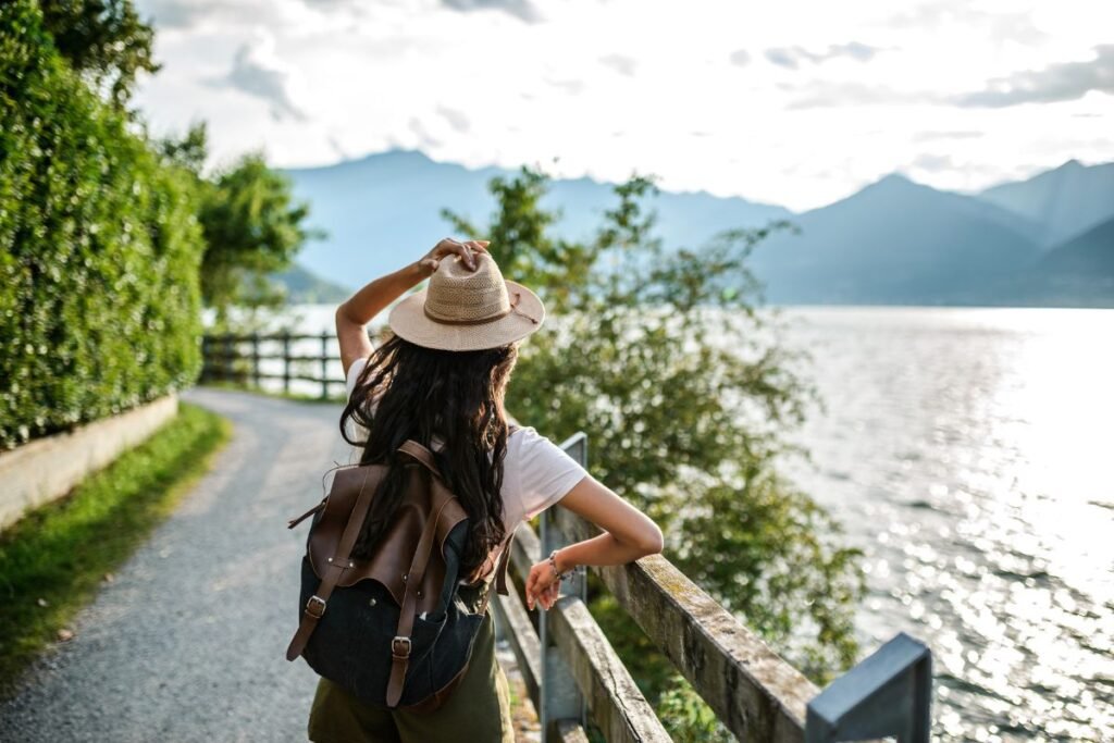 girl appreciating the view to the mountains during her trip