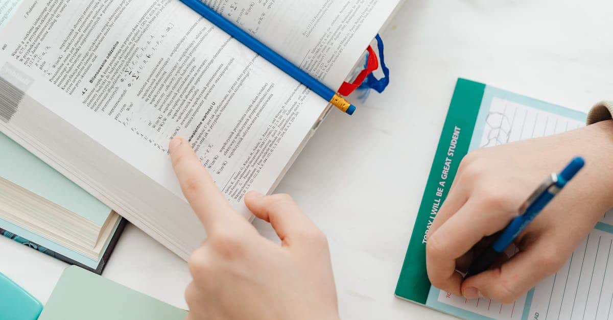 Close-up of a student studying mathematics from an open book with notes on the table.