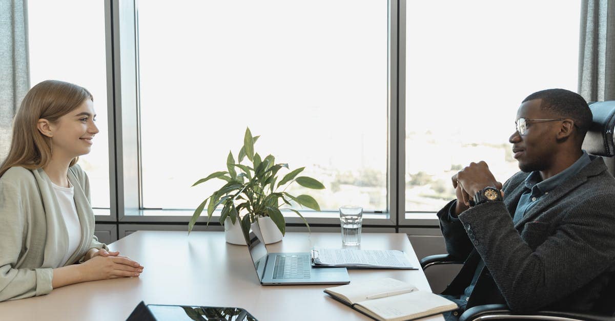 Engaging job interview between two colleagues in a bright, modern office.